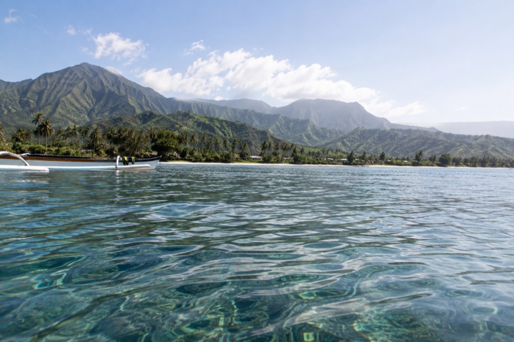 Flat summer water across Hanalei Bay