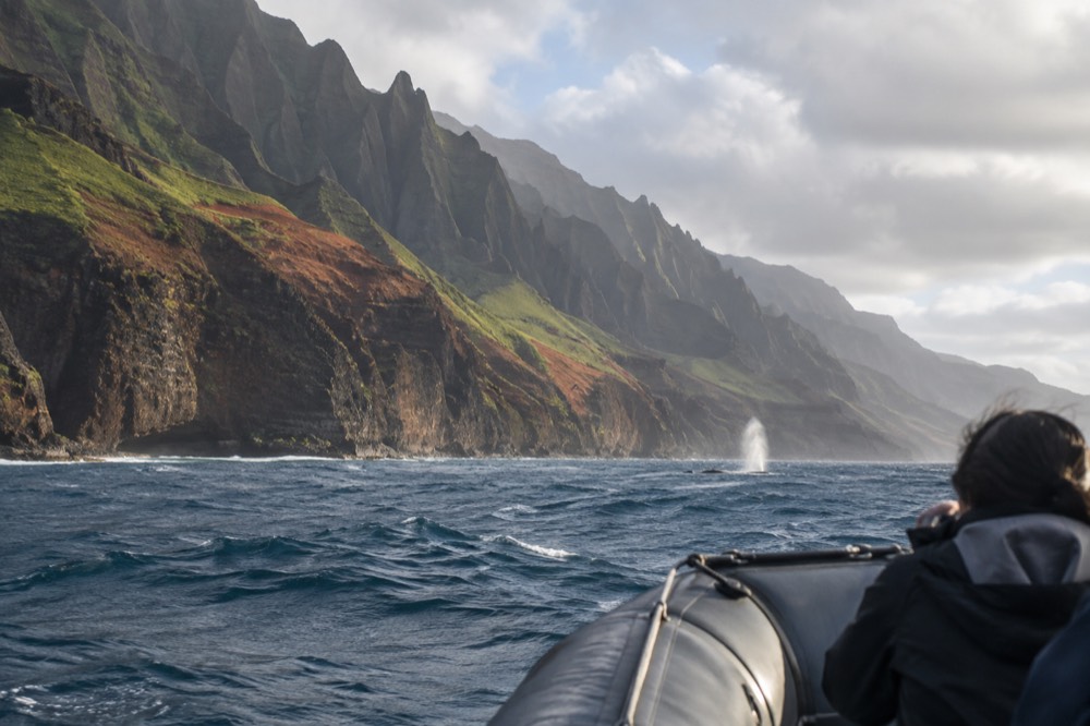 A raft runs the full length of the Napali Coast cliffs